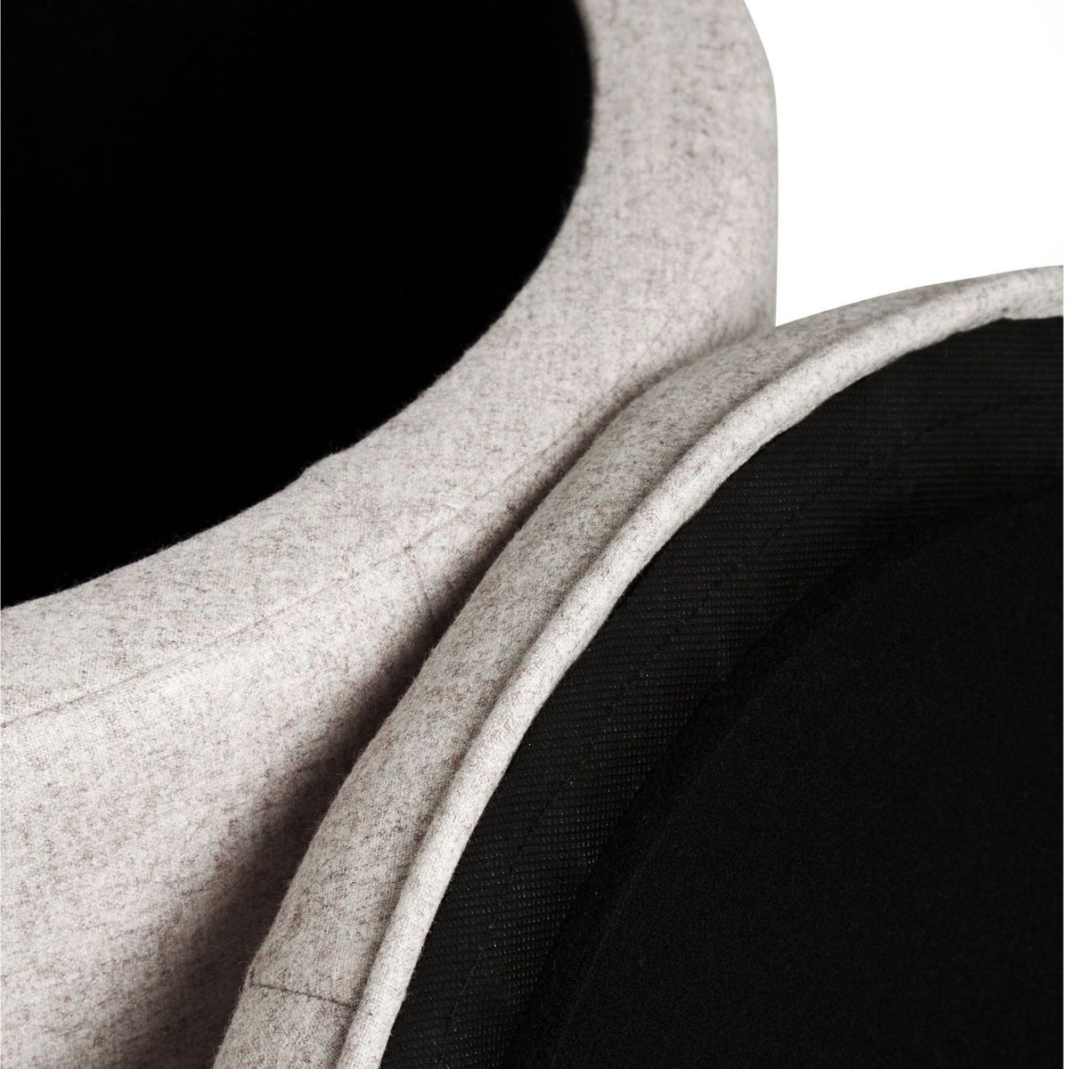 Close-up of a beige fabric texture with a black background