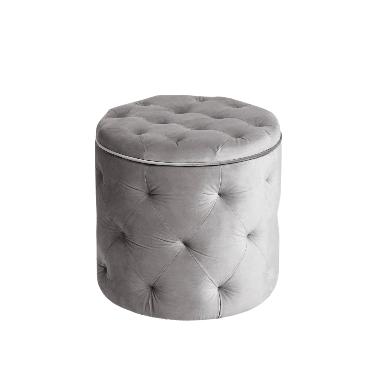Gray tufted ottoman on a white background
