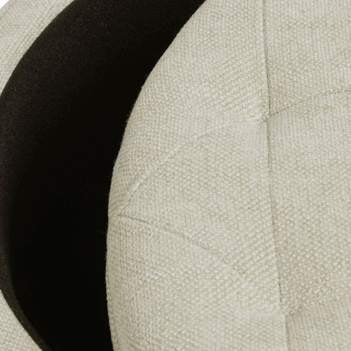 Close-up of a textured beige fabric surface