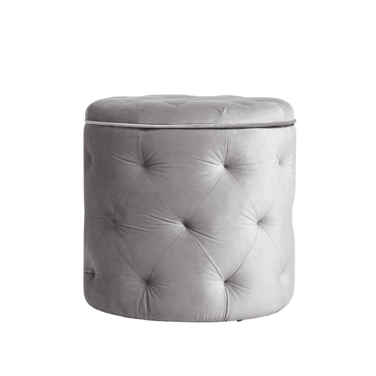 Gray tufted ottoman on a white background