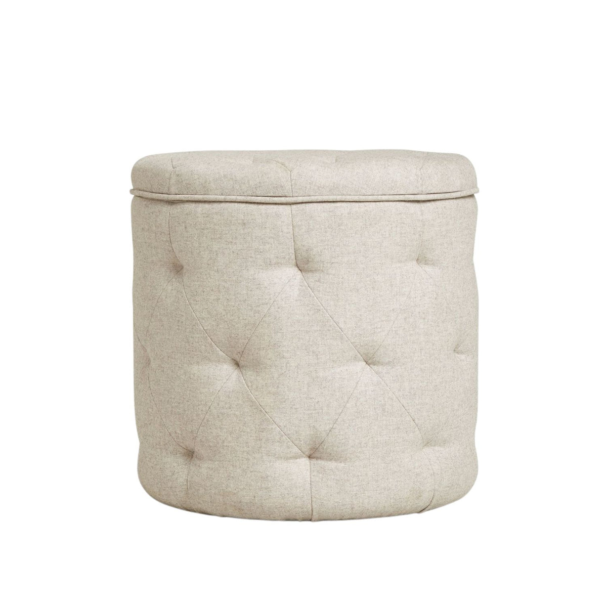 Beige tufted storage ottoman on a white background