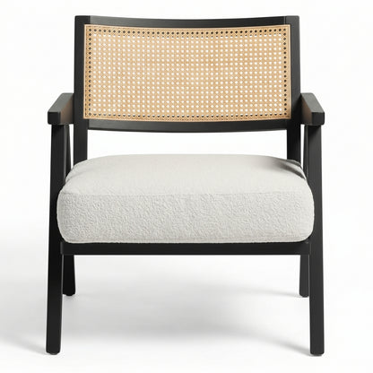 Chair with black frame, woven backrest, and white cushion on a white background