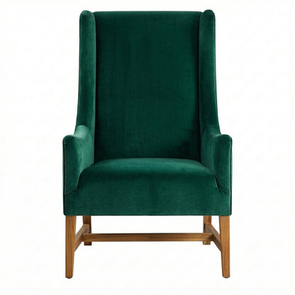 Green velvet armchair with wooden legs on a white background