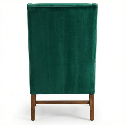 Green velvet chair with wooden legs on a white background