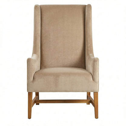 Beige armchair with wooden legs on a white background