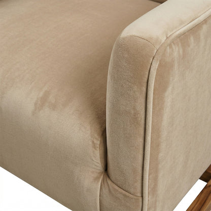 Close-up of a beige upholstered chair corner with a visible stain.