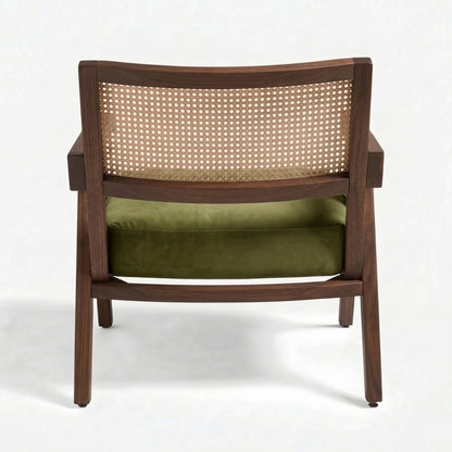 Wooden chair with wicker backrest and green cushion on a white background