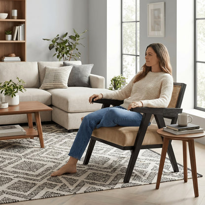 Woman sitting in a modern living room with a neutral color scheme.