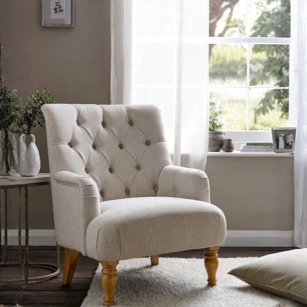 Beige armchair with ottoman in a living room setting