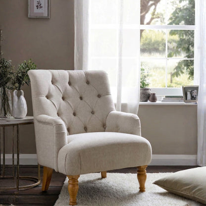 Beige armchair with ottoman in a living room setting