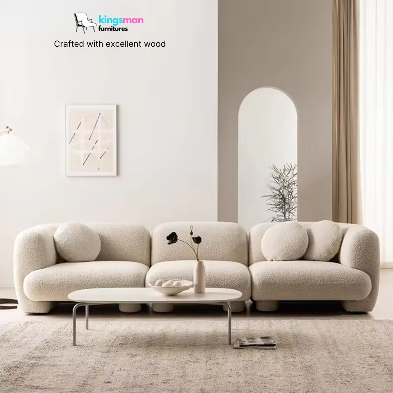Modern beige sofa in a minimalistic living room with 'kingman' furniture branding.