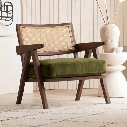 Wooden armchair with a green cushion in a room setting