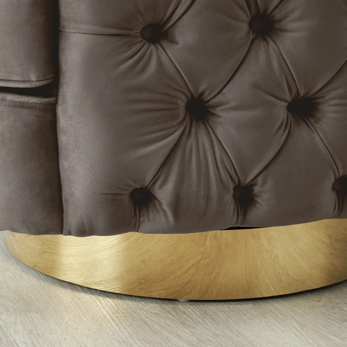 Brown tufted headboard with gold accent on a wooden floor