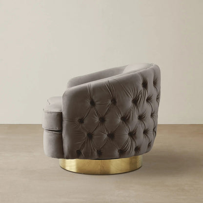 Gray tufted chair with gold base on a beige background