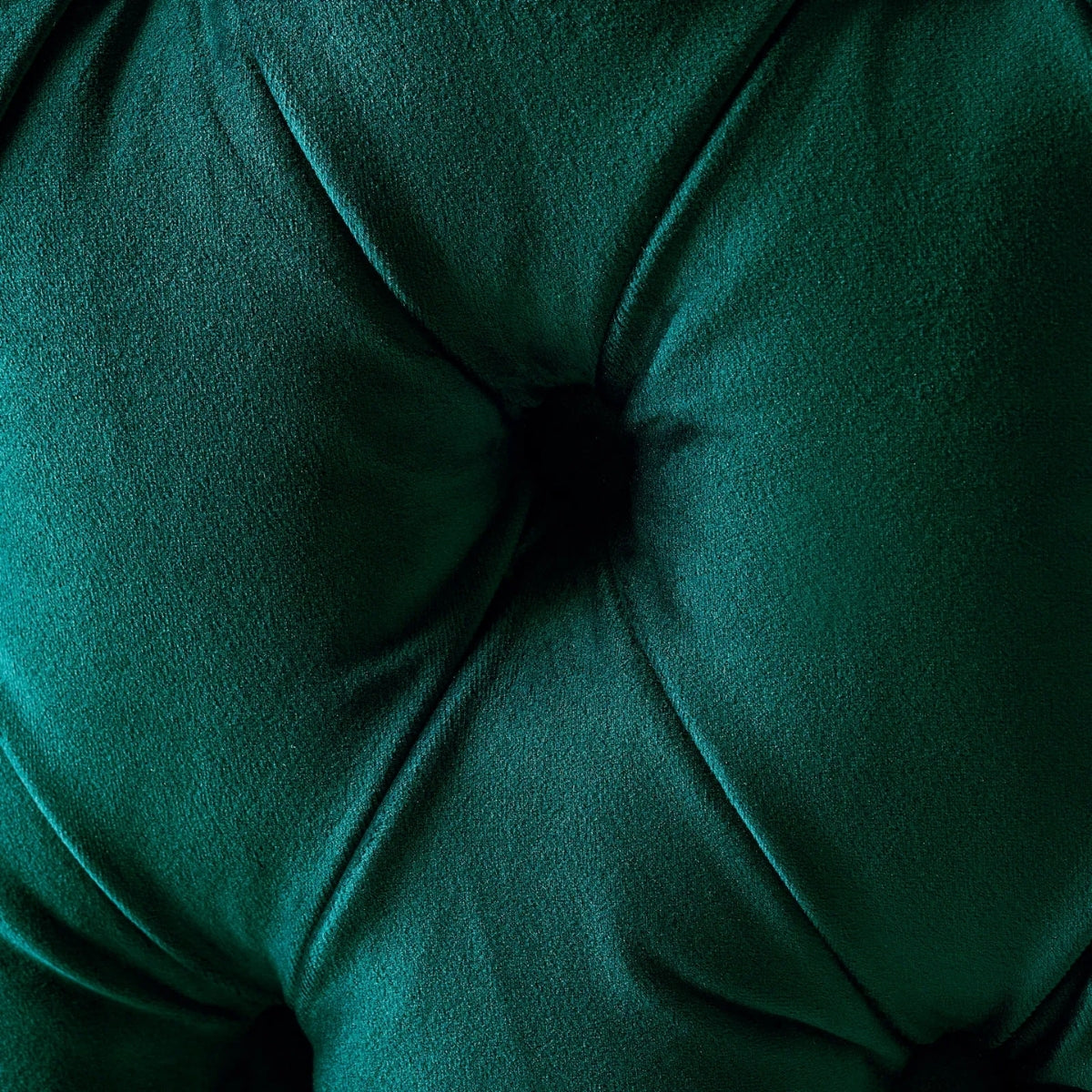 Close-up of a green cushion with tufted texture