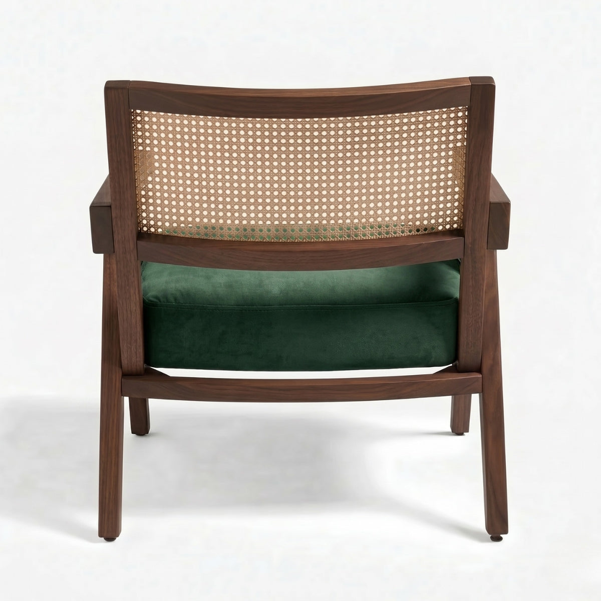 Wooden armchair with wicker backrest and green cushion on a white background