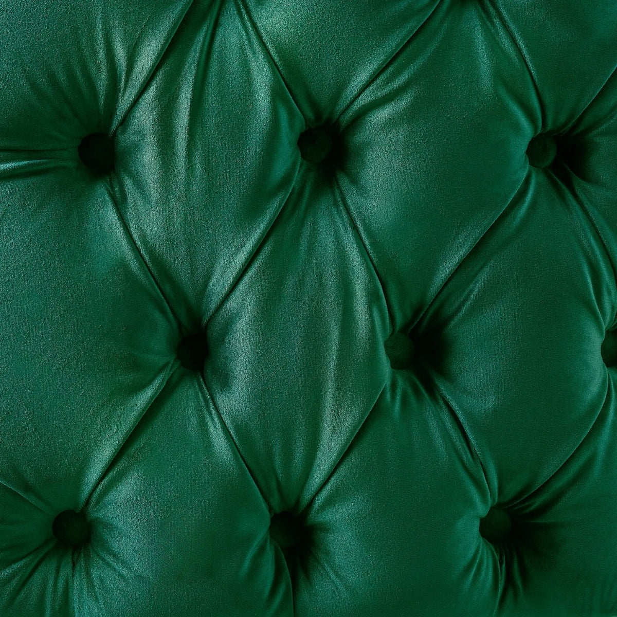 Close-up of a green tufted fabric surface