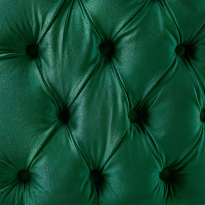 Close-up of a green tufted fabric surface
