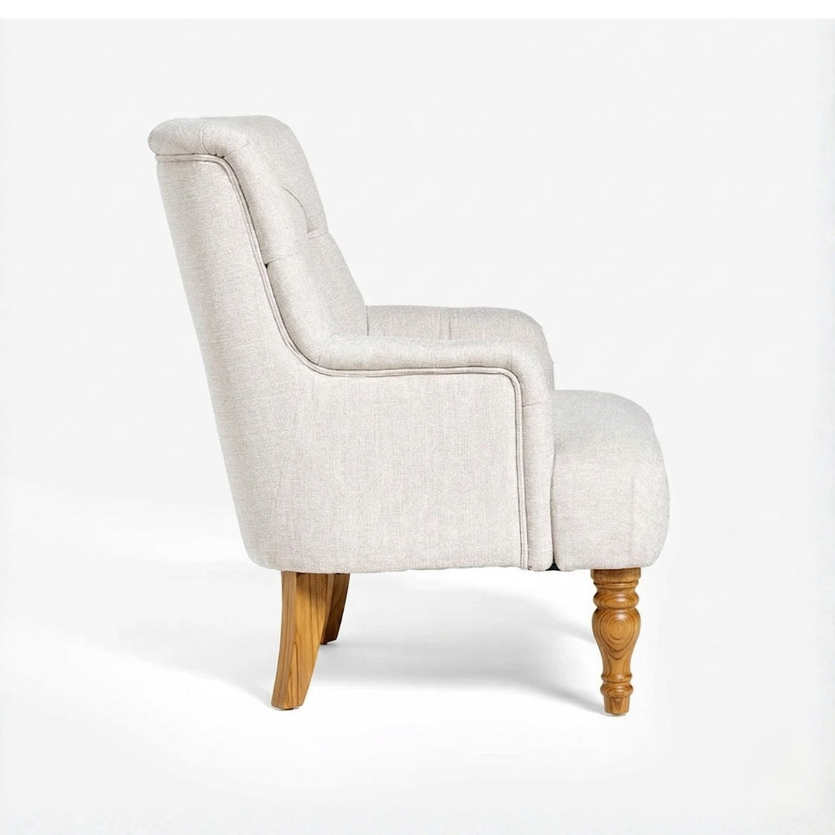 Beige armchair with wooden legs on a white background