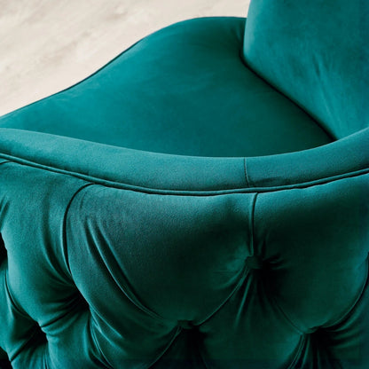 Close-up of a teal velvet chair with tufted backrest