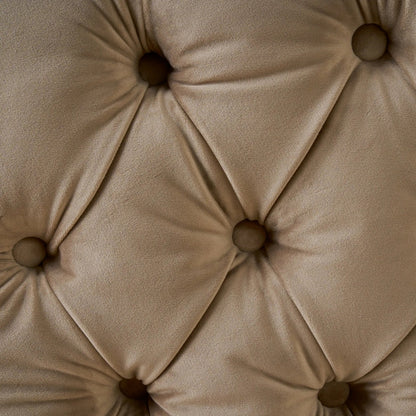 Close-up of a beige tufted cushion with button details