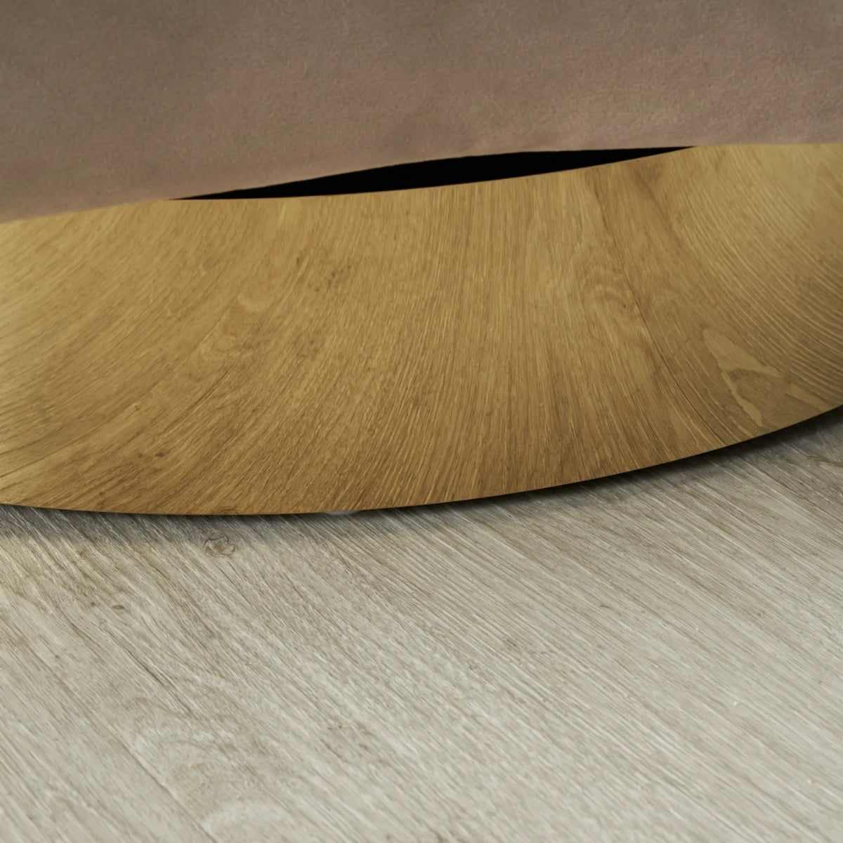 Wooden circular object on a wooden floor