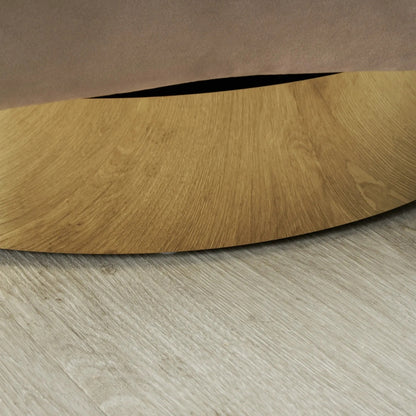 Wooden circular object on a wooden floor