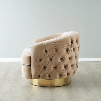Beige tufted armchair with gold base on a light gray floor and wall.