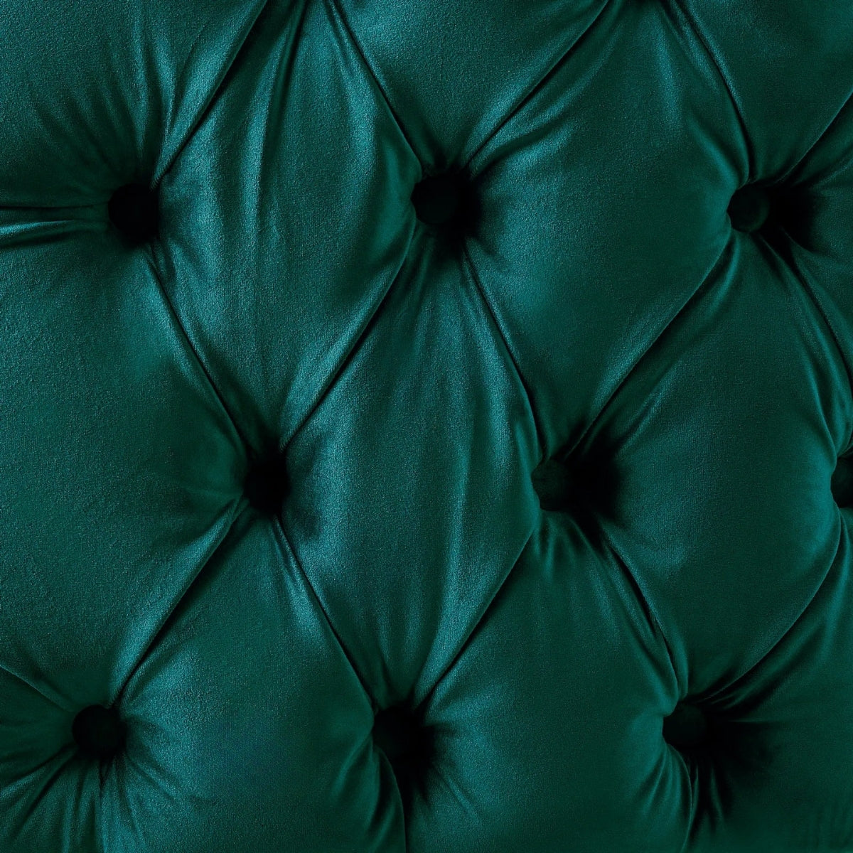 Close-up of a green tufted velvet surface
