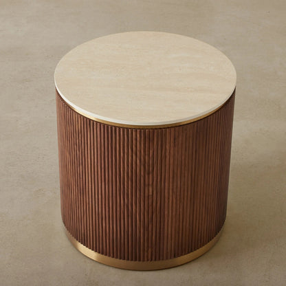 Round wooden side table with a beige top on a beige background