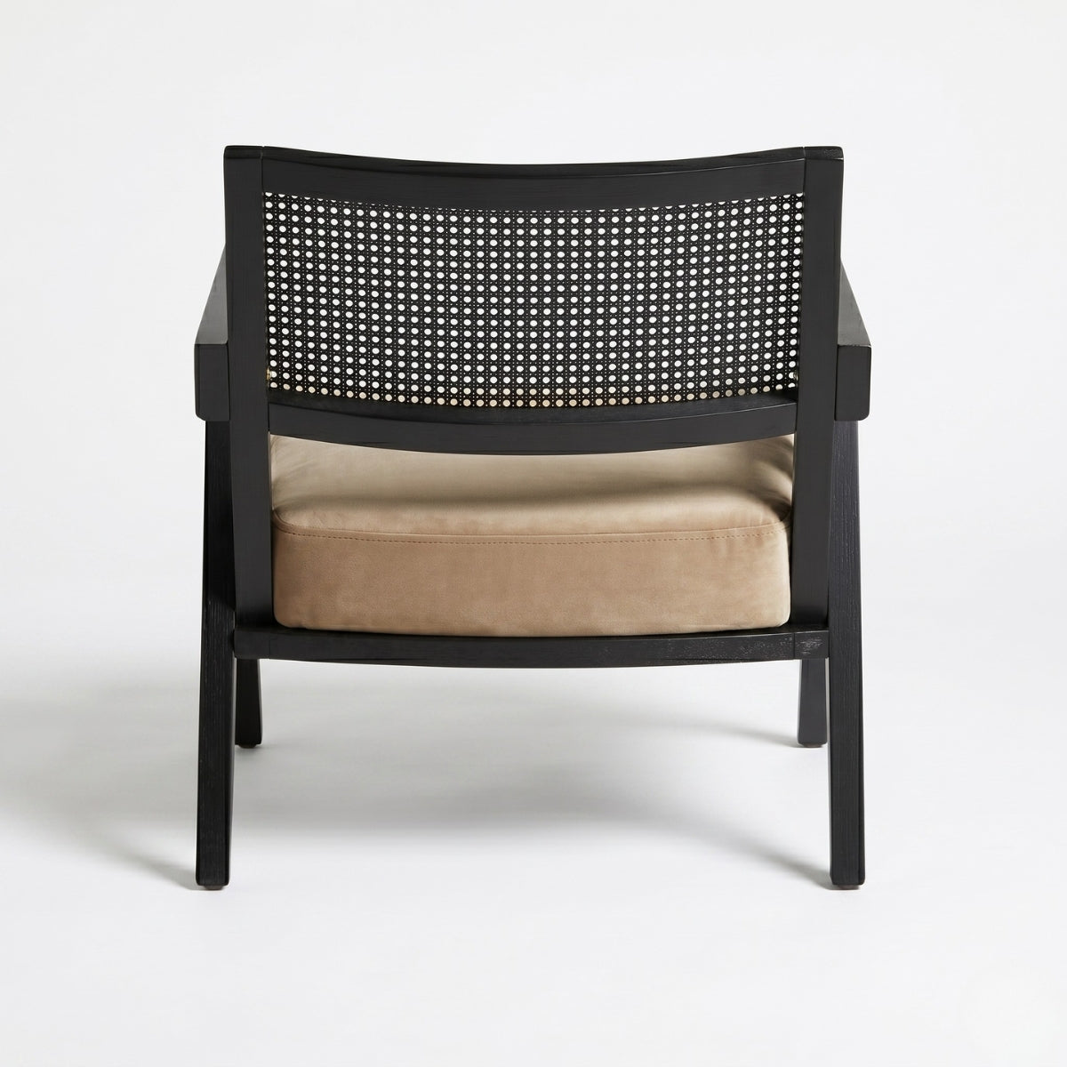 Black chair with woven backrest and beige cushion on a white background