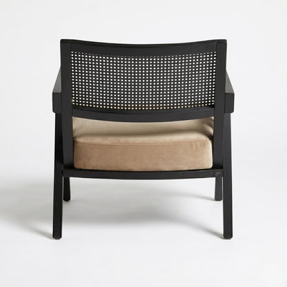 Black chair with woven backrest and beige cushion on a white background