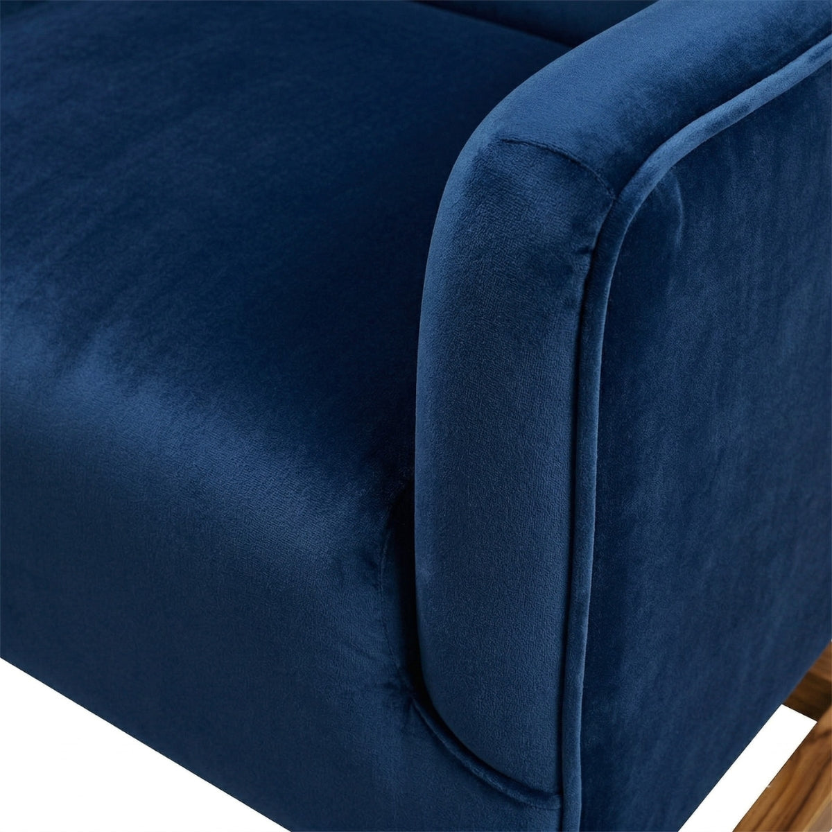 Close-up of a blue velvet armchair corner