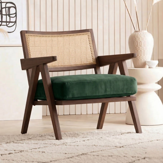 Wooden armchair with green cushion in a room setting