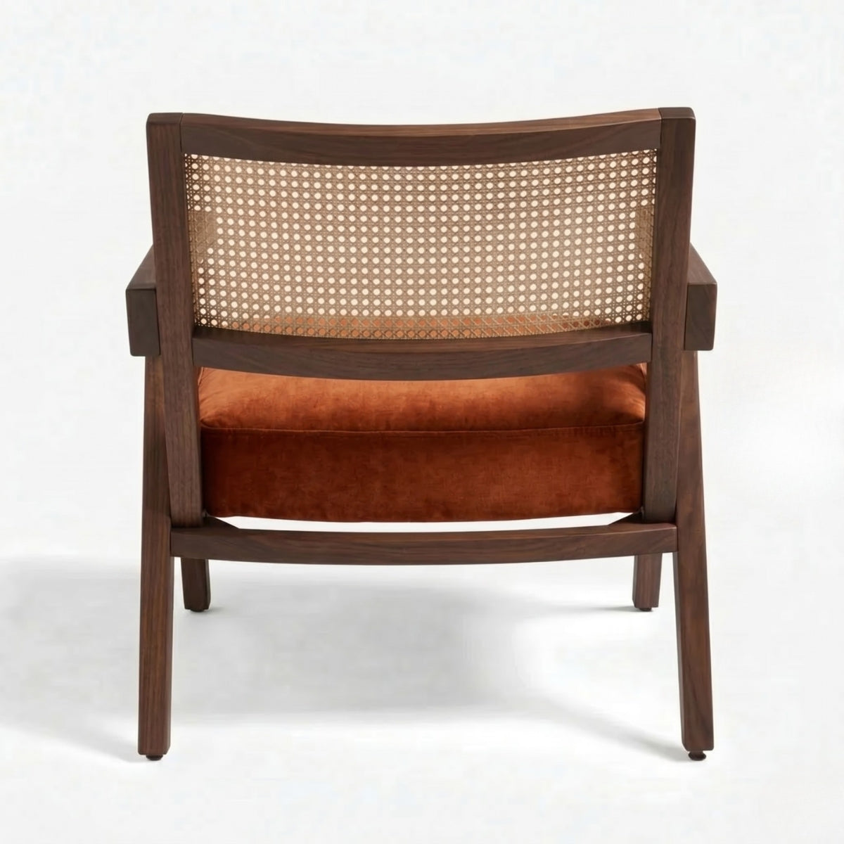 Wooden armchair with a woven backrest and orange cushion on a white background