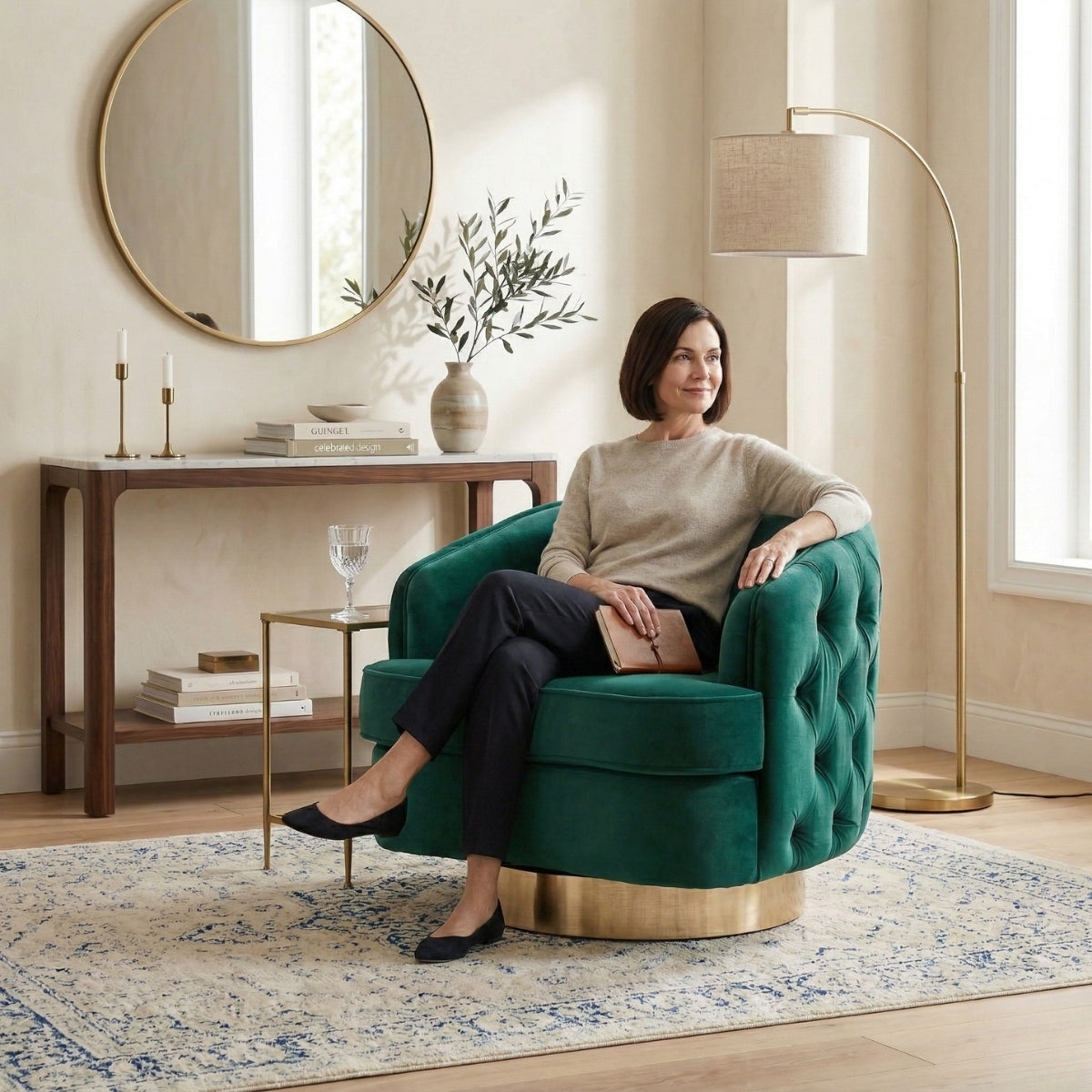 Woman sitting on a green armchair in a stylish living room.