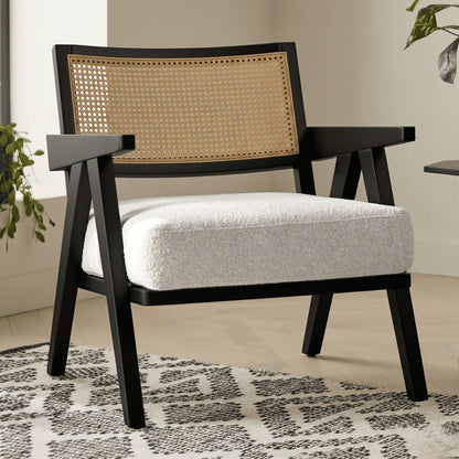 Chair with black frame and woven backrest on a patterned rug