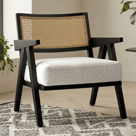 Chair with black frame and woven backrest on a patterned rug